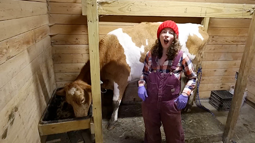 Farmer with her dairy cow