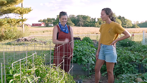 Two women talking about the family garden